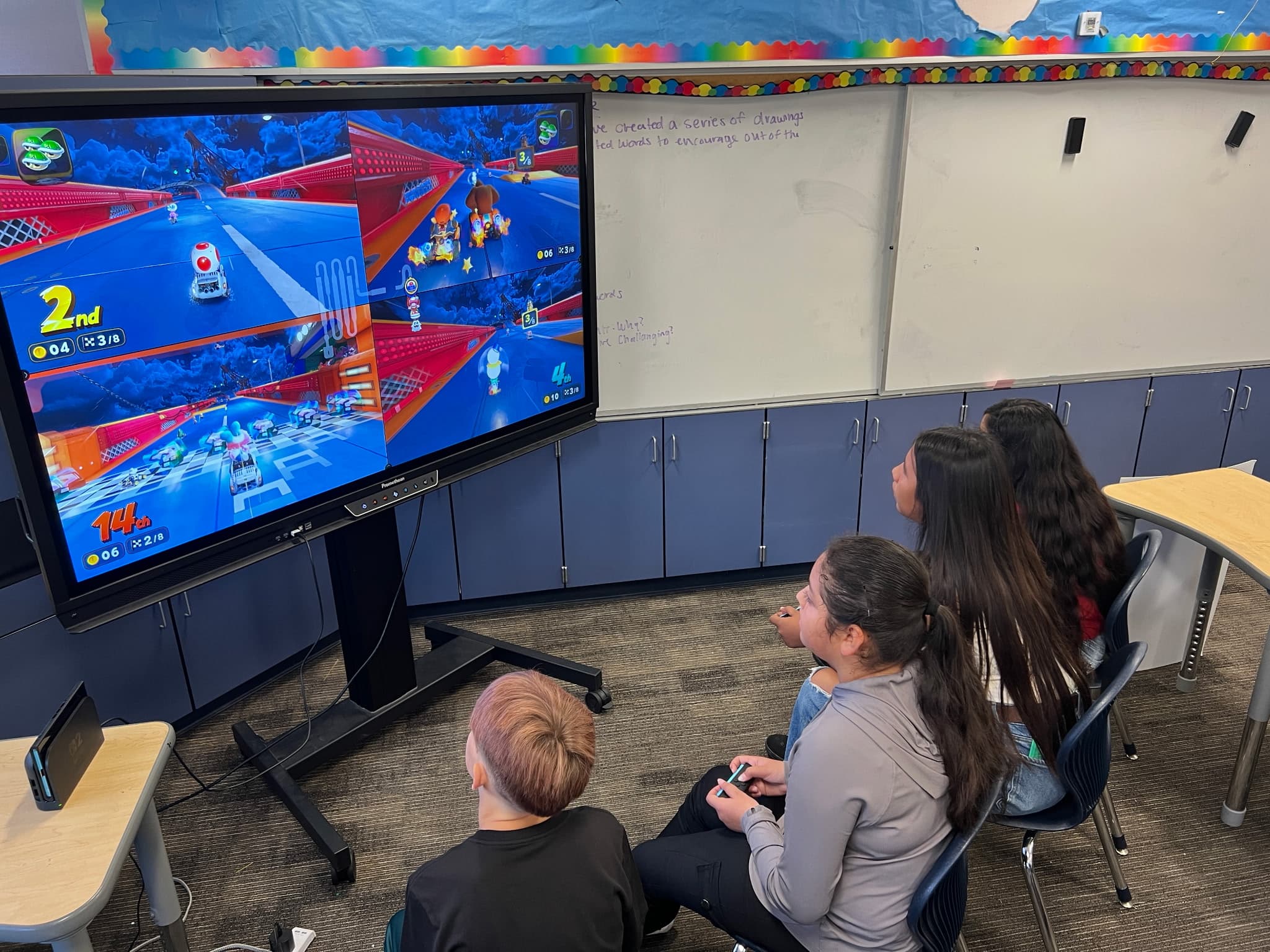 Students playing a multiplayer racing game together during an iAttend esports session.